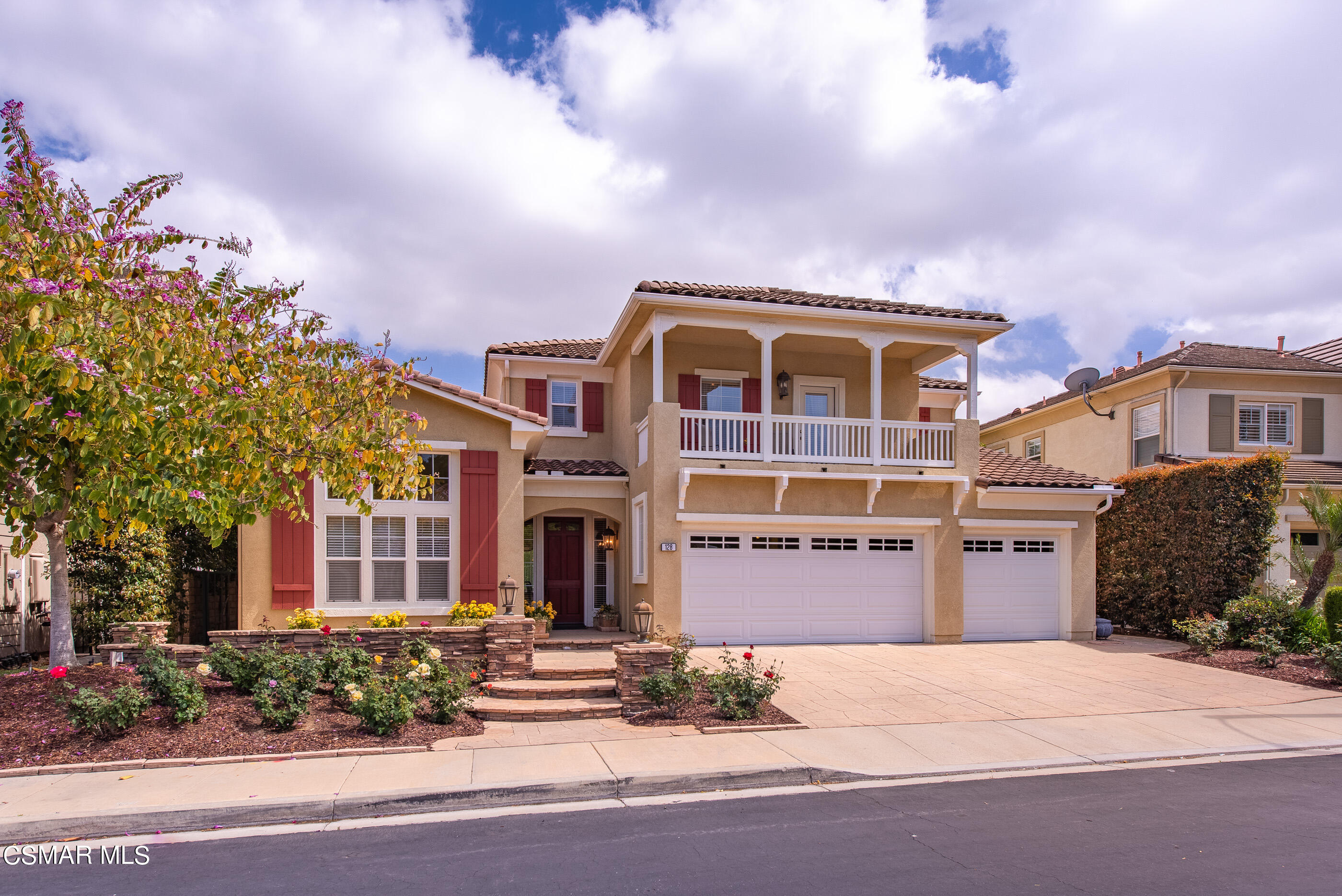 128 Laurel Ridge Drive Simi Valley, CA 93065 - Photo 1 of 66 a front view of a building with a garden