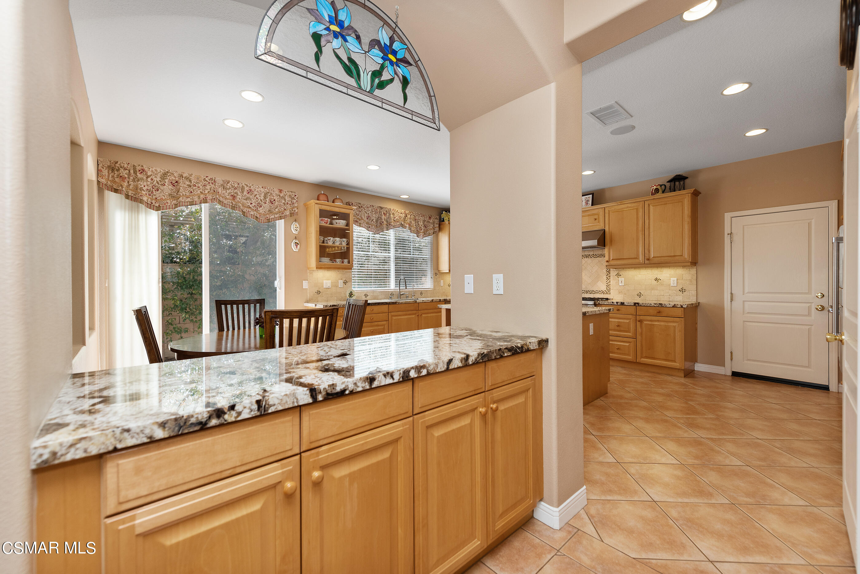 128 Laurel Ridge Drive Simi Valley, CA 93065 - Photo 15 of 66 a kitchen with granite countertop a sink and white cabinets