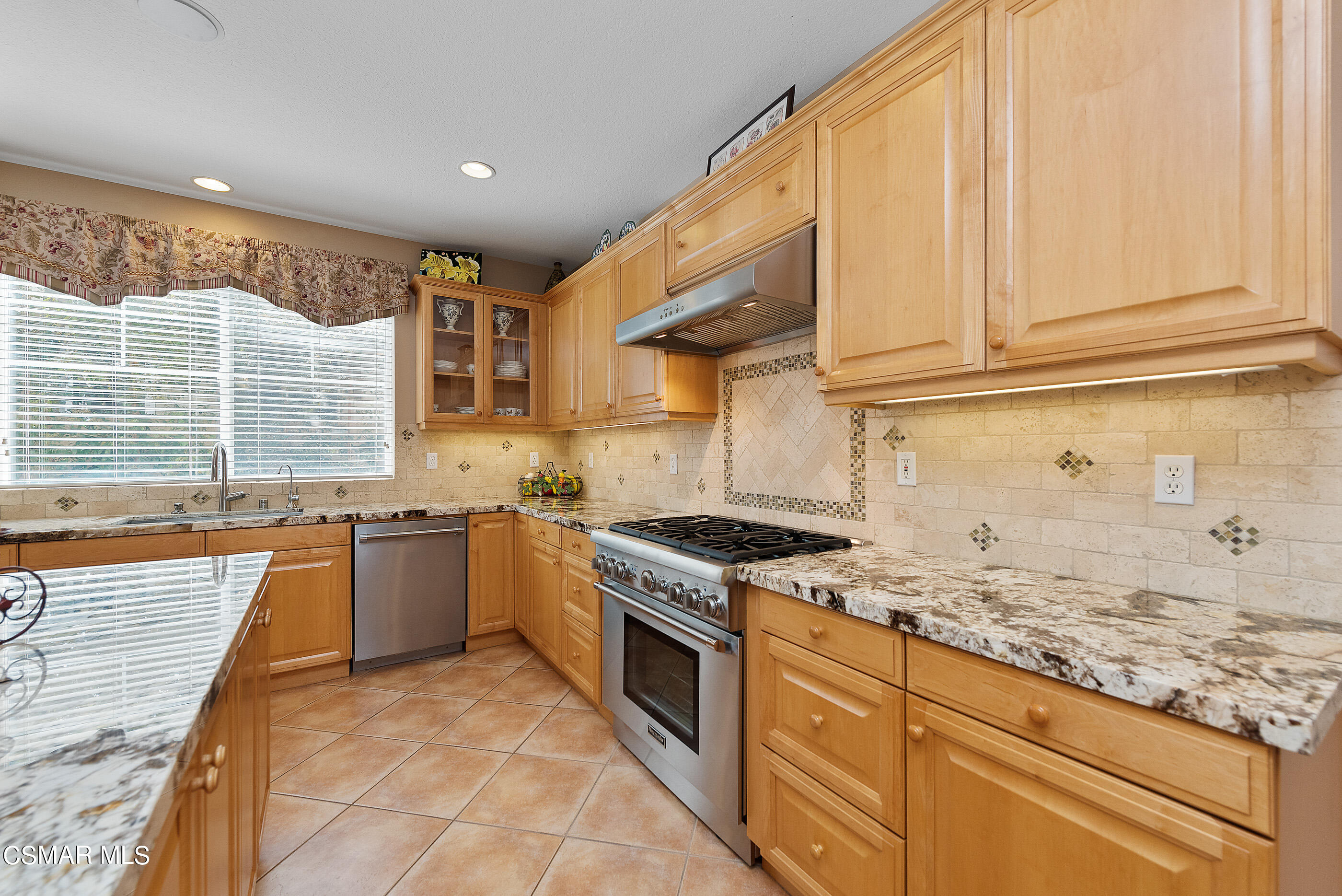 128 Laurel Ridge Drive Simi Valley, CA 93065 - Photo 17 of 66 a kitchen with stainless steel appliances granite countertop a stove sink and cabinets