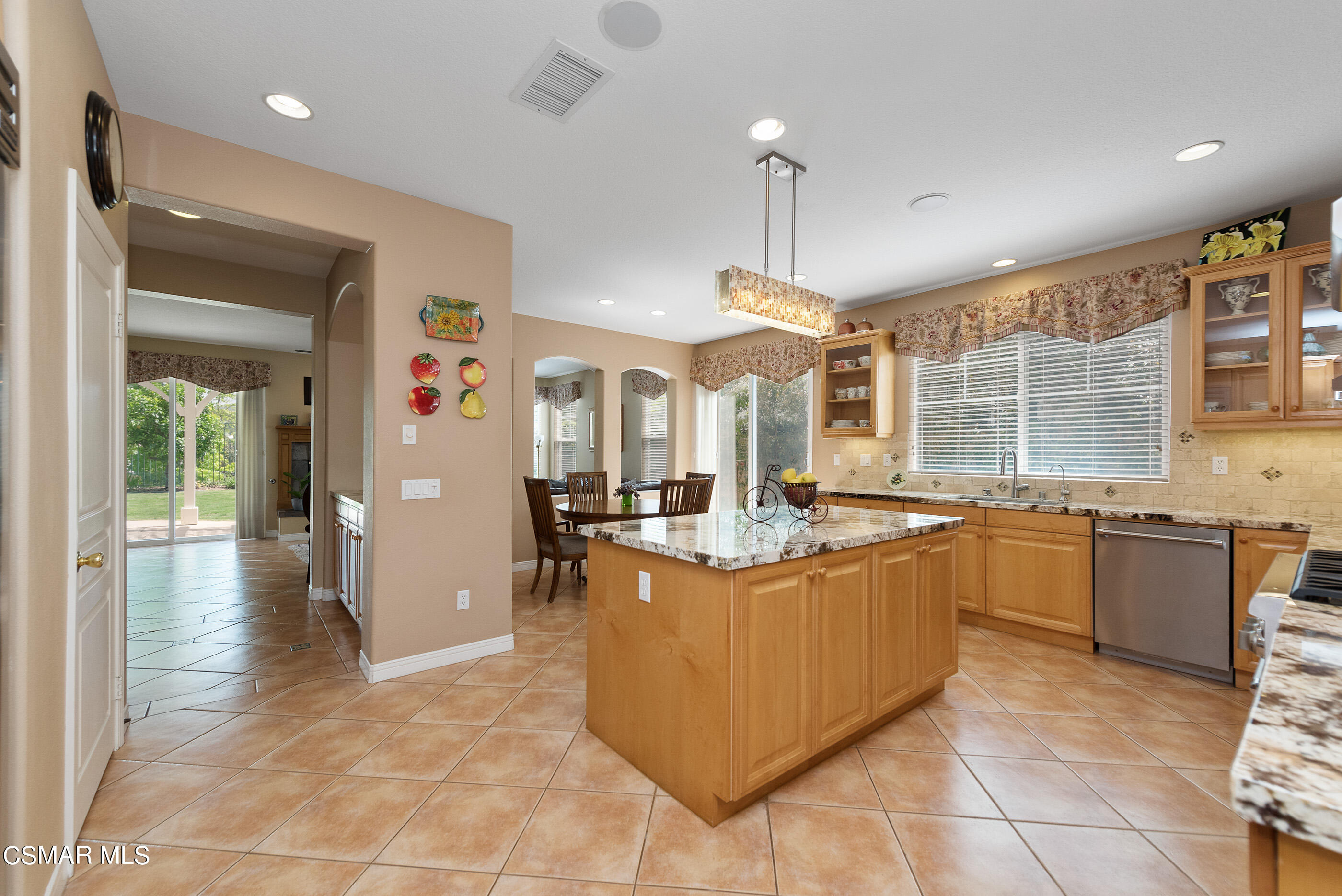 128 Laurel Ridge Drive Simi Valley, CA 93065 - Photo 18 of 66 a kitchen with stainless steel appliances granite countertop a sink and a refrigerator