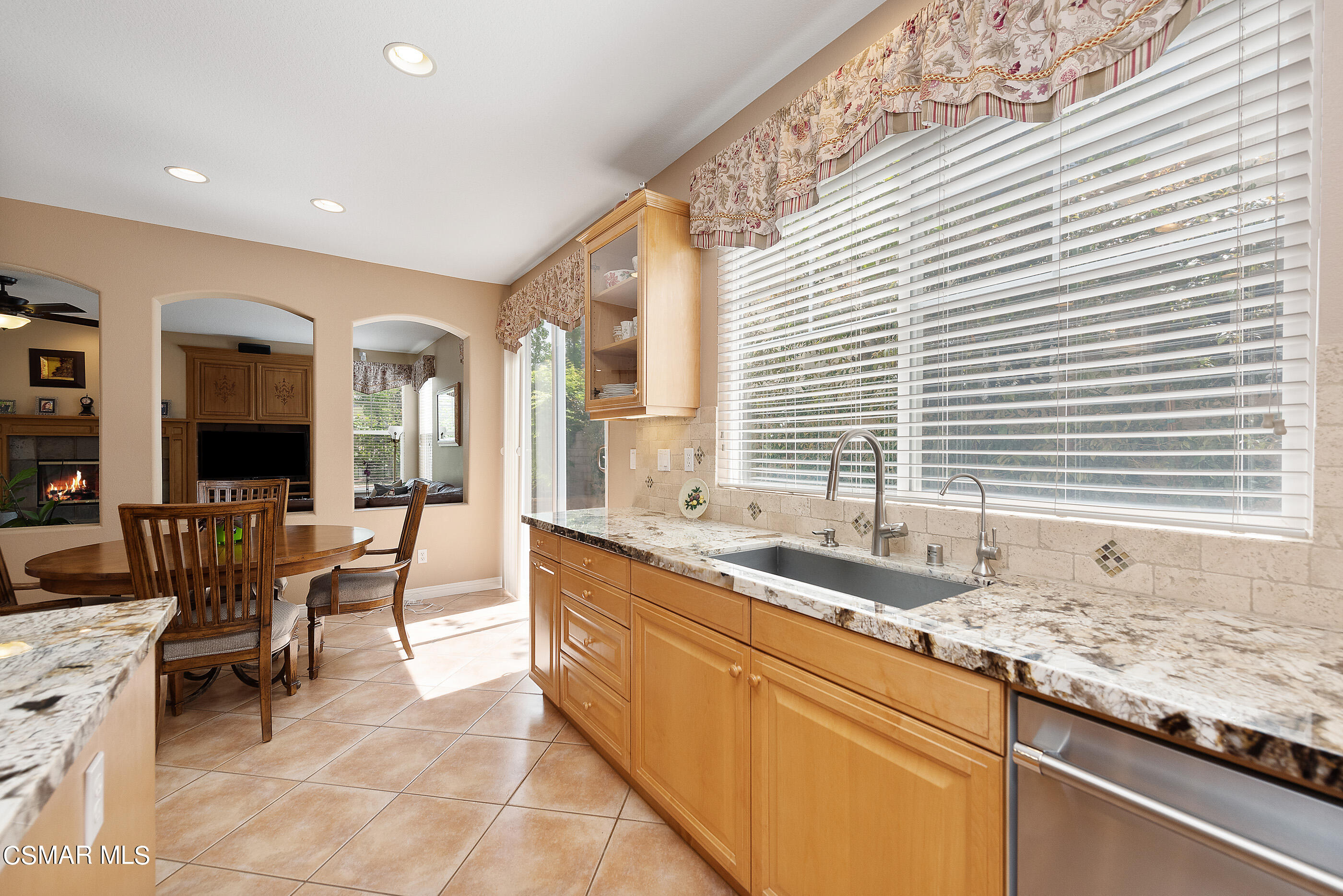 128 Laurel Ridge Drive Simi Valley, CA 93065 - Photo 19 of 66 a large white kitchen with granite countertop a sink and a large window