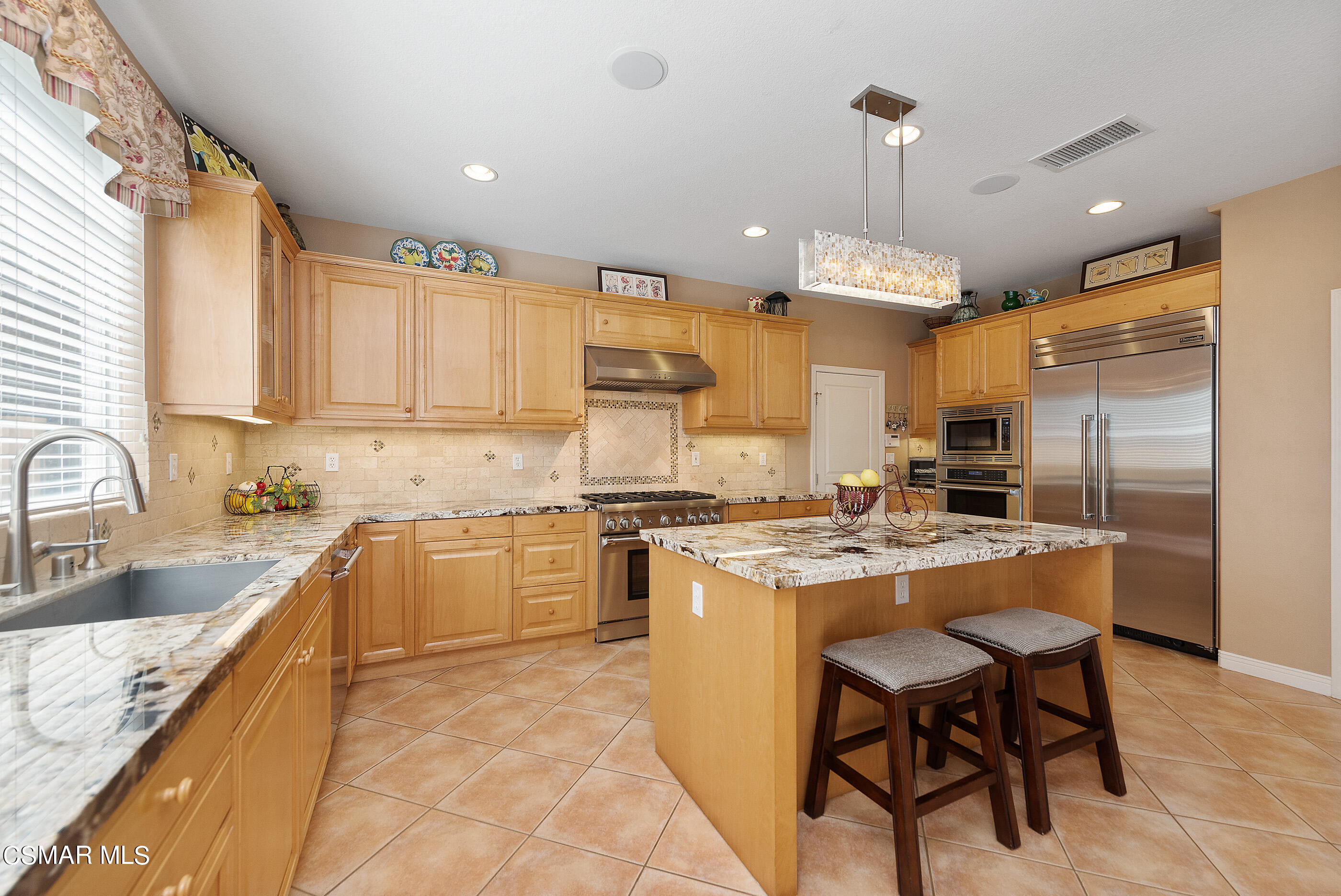 128 Laurel Ridge Drive Simi Valley, CA 93065 - Photo 20 of 66 a kitchen with stainless steel appliances granite countertop a sink stove and refrigerator