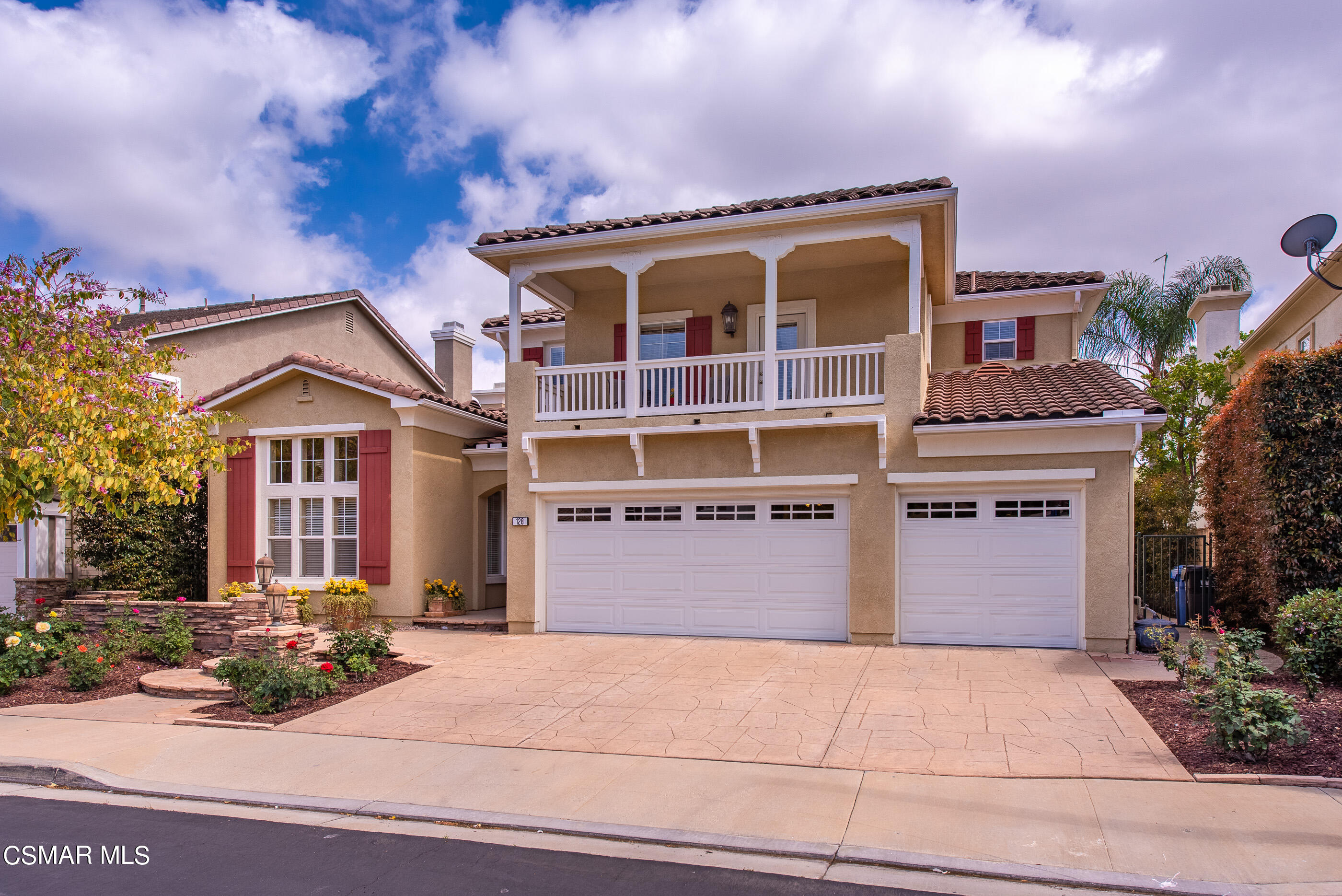 128 Laurel Ridge Drive Simi Valley, CA 93065 - Photo 2 of 66 a front view of a house with a yard and garage