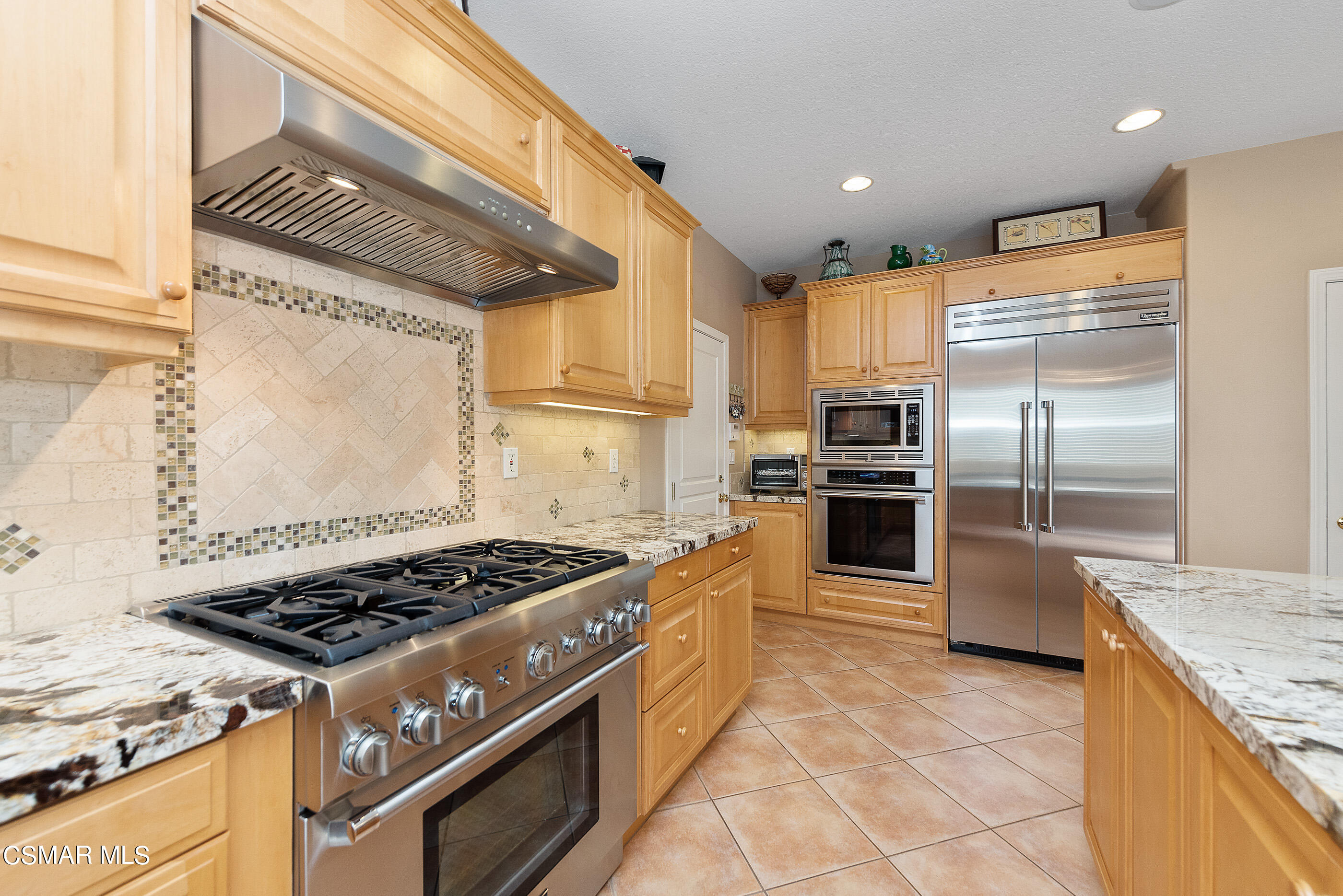 128 Laurel Ridge Drive Simi Valley, CA 93065 - Photo 21 of 66 a kitchen with stainless steel appliances granite countertop a stove a refrigerator and a sink