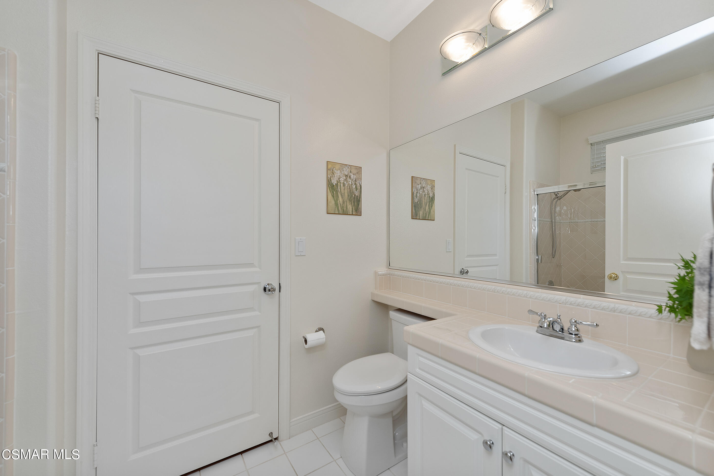 128 Laurel Ridge Drive Simi Valley, CA 93065 - Photo 26 of 66 a bathroom with a granite countertop toilet sink and mirror