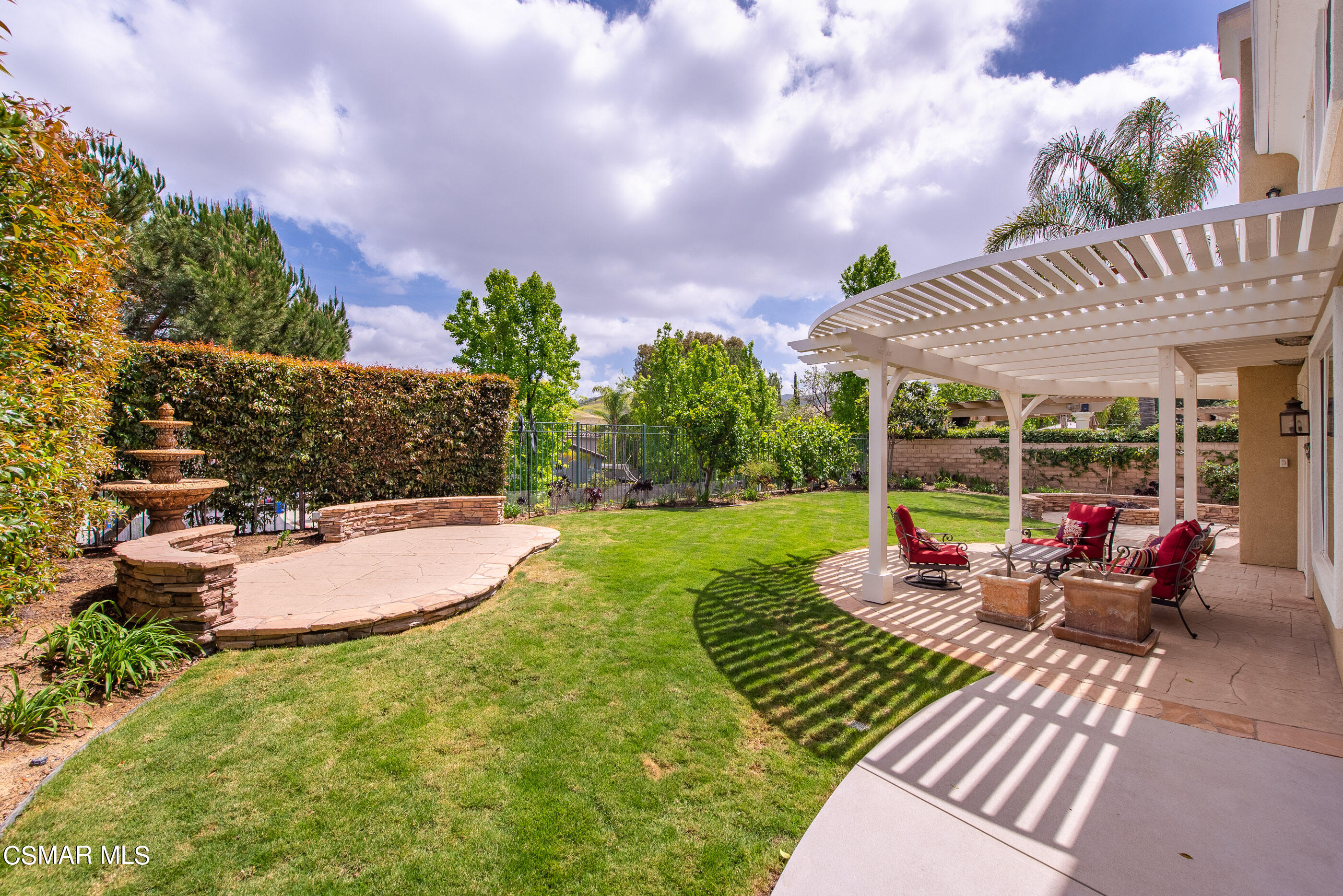 128 Laurel Ridge Drive Simi Valley, CA 93065 - Photo 52 of 66 a view of a backyard with sitting area and garden
