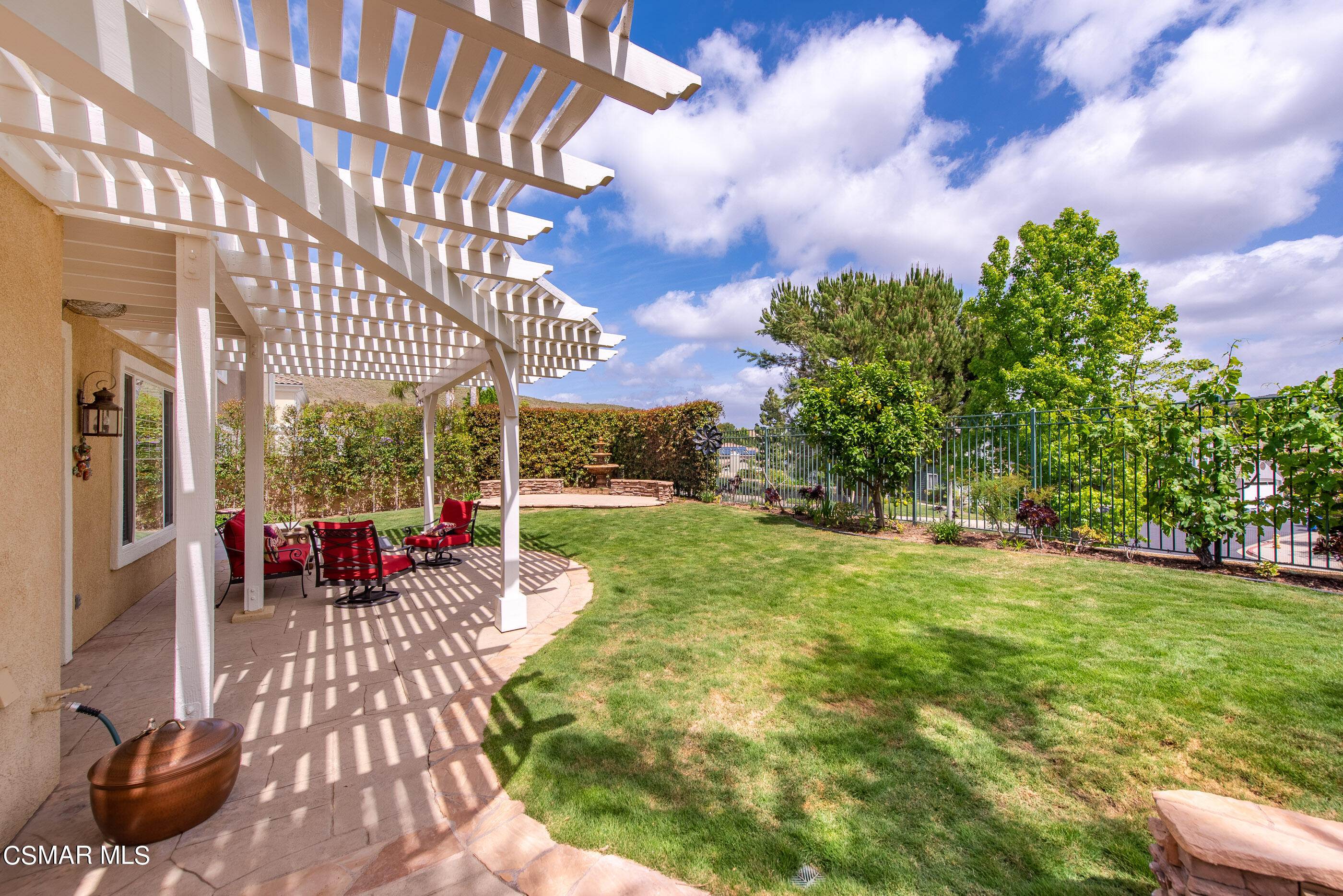 128 Laurel Ridge Drive Simi Valley, CA 93065 - Photo 58 of 66 a view of a patio with couches potted plants and a big yard