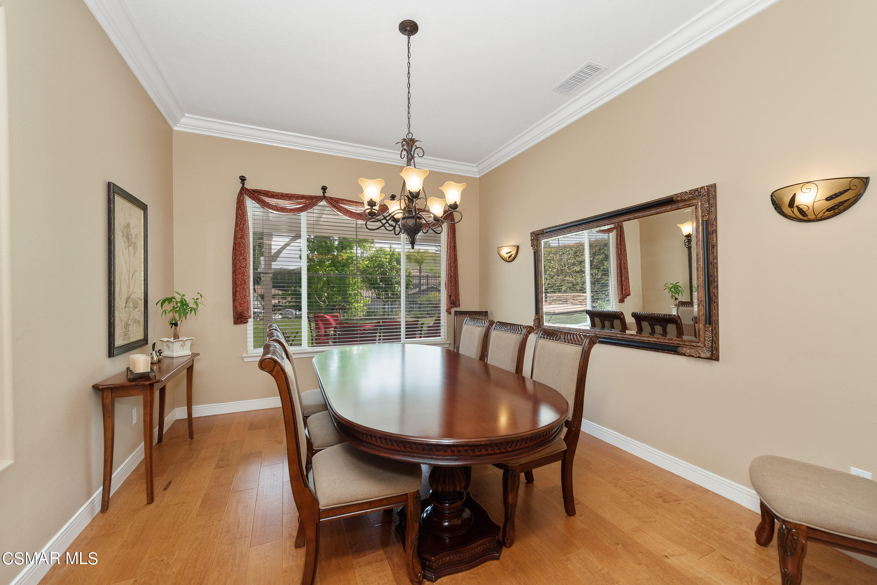 128 Laurel Ridge Drive Simi Valley, CA 93065 - Photo 9 of 66 a dining room with furniture a chandelier and wooden floor