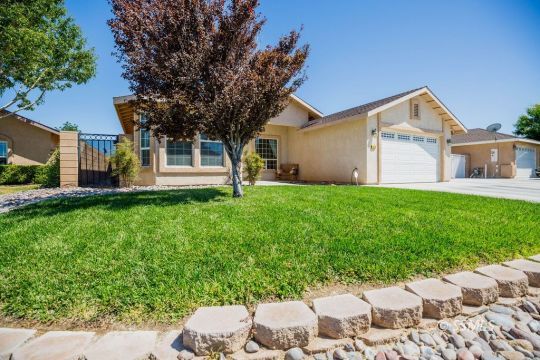 408 Acacia Street Ridgecrest, CA 93555 - Photo 3 of 32 a front view of house with yard and trees