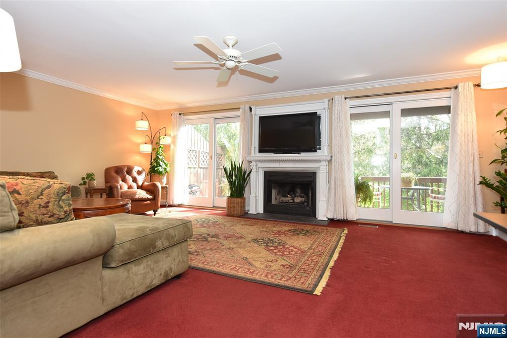 41 Litchult Lane Mahwah, NJ 07430 - Photo 13 of 50 a living room with furniture and a fireplace
