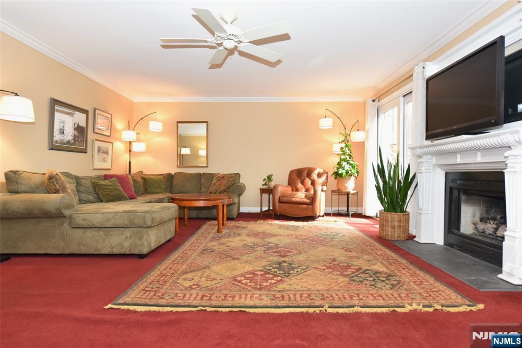 41 Litchult Lane Mahwah, NJ 07430 - Photo 14 of 50 a living room with furniture fireplace and flat screen tv