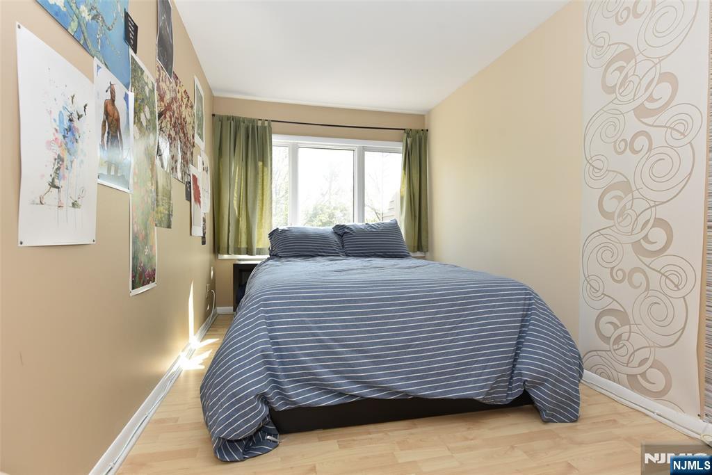 41 Litchult Lane Mahwah, NJ 07430 - Photo 34 of 50 a bedroom with a bed and a window