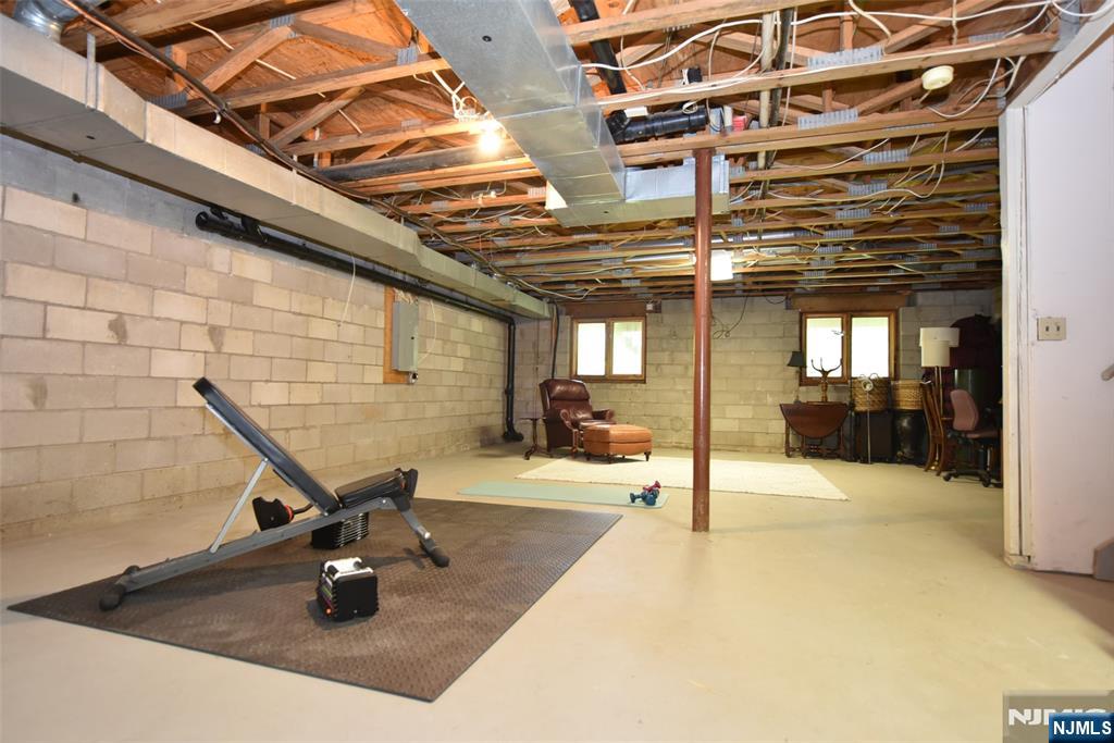 41 Litchult Lane Mahwah, NJ 07430 - Photo 35 of 50 a view of a patio with a table and chairs