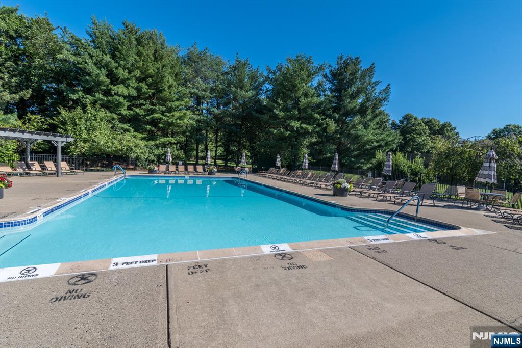 41 Litchult Lane Mahwah, NJ 07430 - Photo 40 of 50 a view of a tennis ground with trees in the background