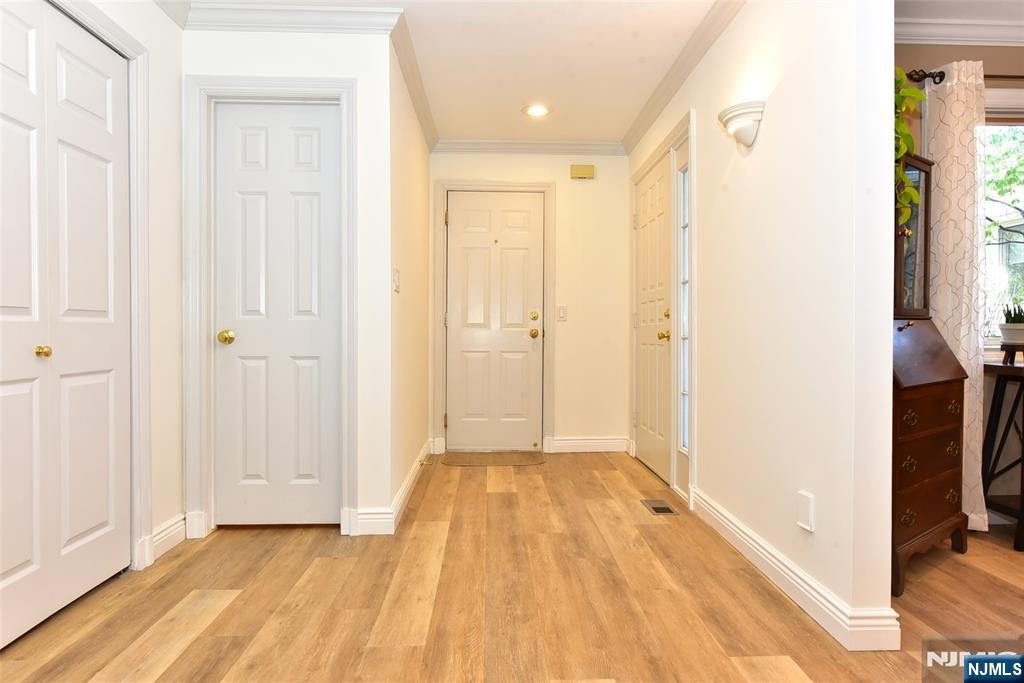 41 Litchult Lane Mahwah, NJ 07430 - Photo 4 of 50 a view of a hallway with wooden floor and a bathroom