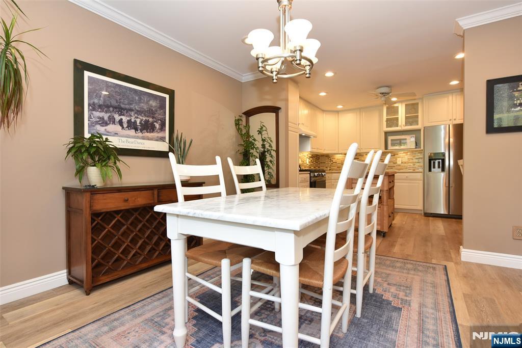 41 Litchult Lane Mahwah, NJ 07430 - Photo 8 of 50 a view of a dining room with furniture and chandelier