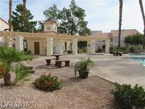 7570 West Flamingo Road, Unit 125 Las Vegas, NV 89147 - Photo 25 of 29 View of home's community with a patio area and a pool