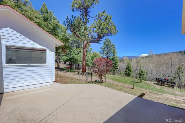 a backyard of a house with outdoor seating