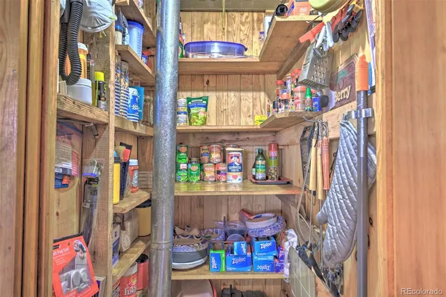 a view of storage and utility room with stairs