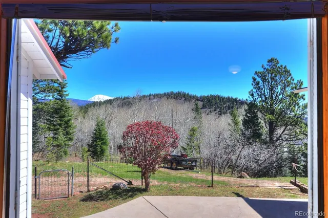 a living room with furniture a fireplace and a table