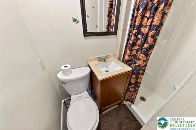 a bathroom with a toilet and a sink
