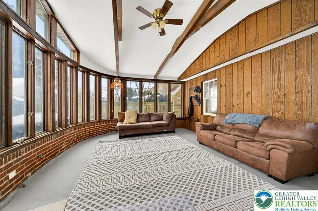 a living room with furniture and a rug