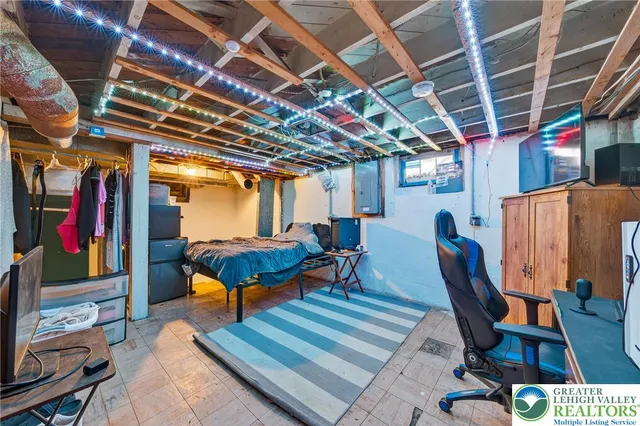 a roof deck with chair and wooden fence