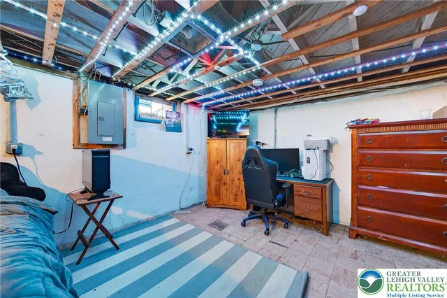 a view of gym equipment with wooden floor