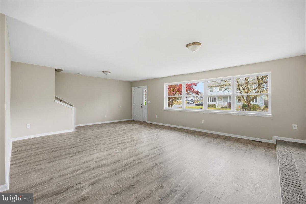 36 Dancy Avenue Sewell, NJ 08080 - Photo 11 of 32 wooden floor in an empty room with a window