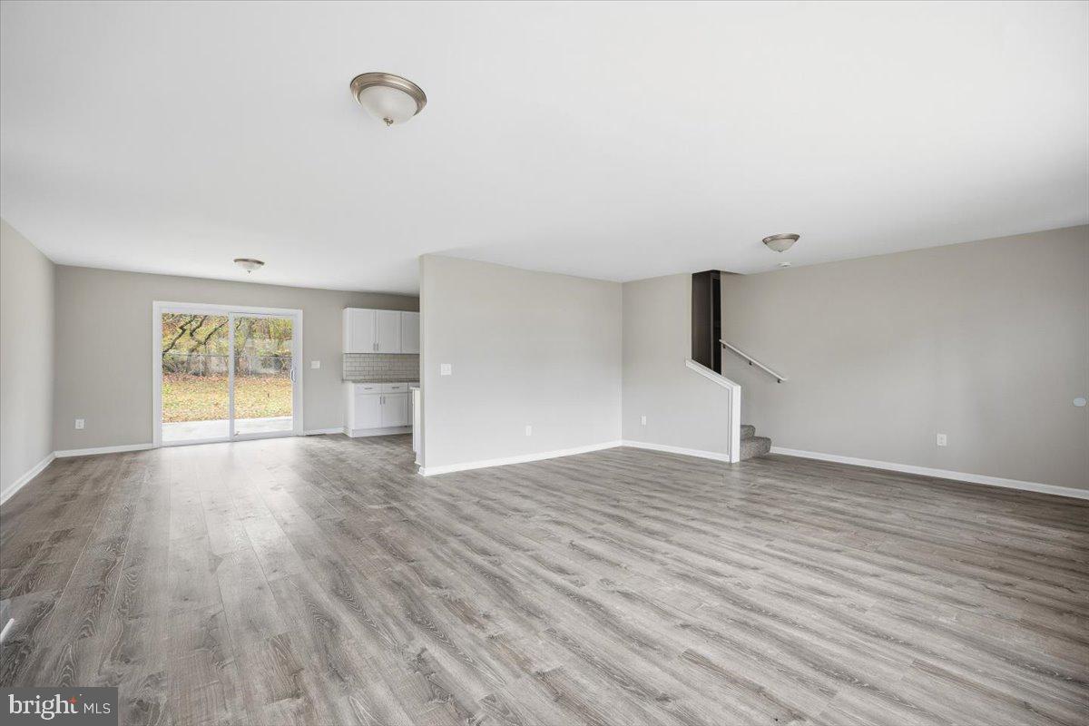 36 Dancy Avenue Sewell, NJ 08080 - Photo 12 of 32 a view of empty room with wooden floor and fan