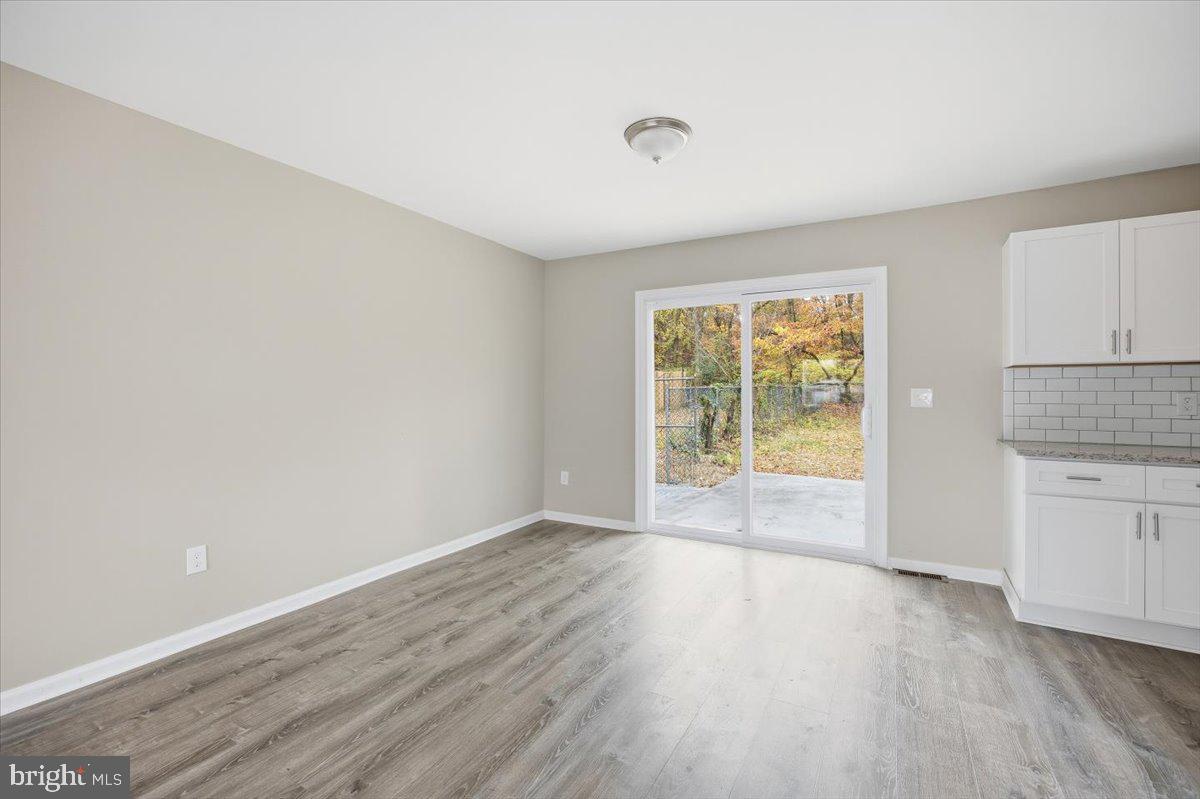 36 Dancy Avenue Sewell, NJ 08080 - Photo 13 of 32 an empty room with wooden floor and windows