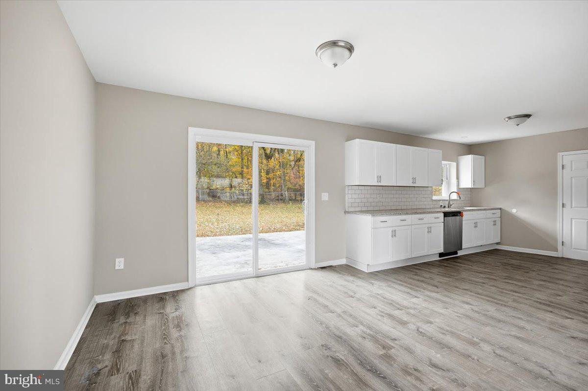 36 Dancy Avenue Sewell, NJ 08080 - Photo 14 of 32 a view of an empty room with wooden floor and a window