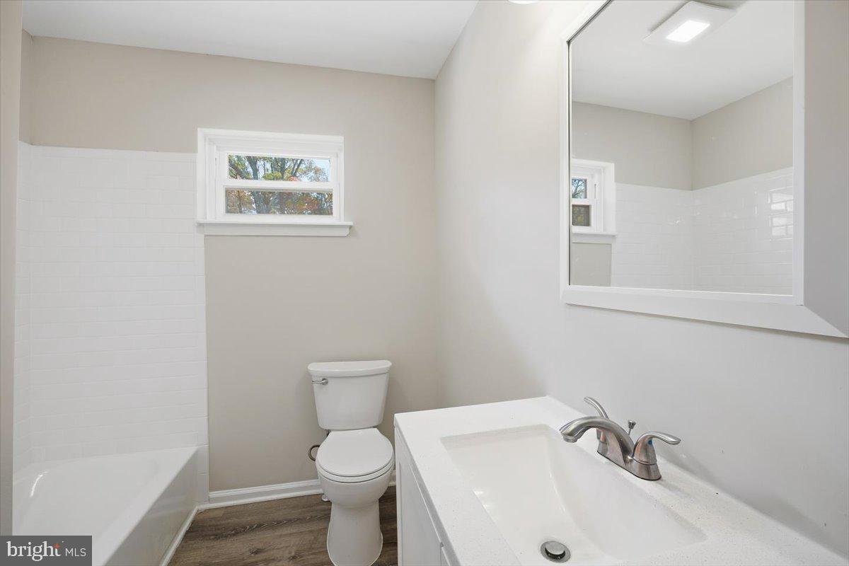 36 Dancy Avenue Sewell, NJ 08080 - Photo 29 of 32 a white toilet sitting next to a bathroom sink