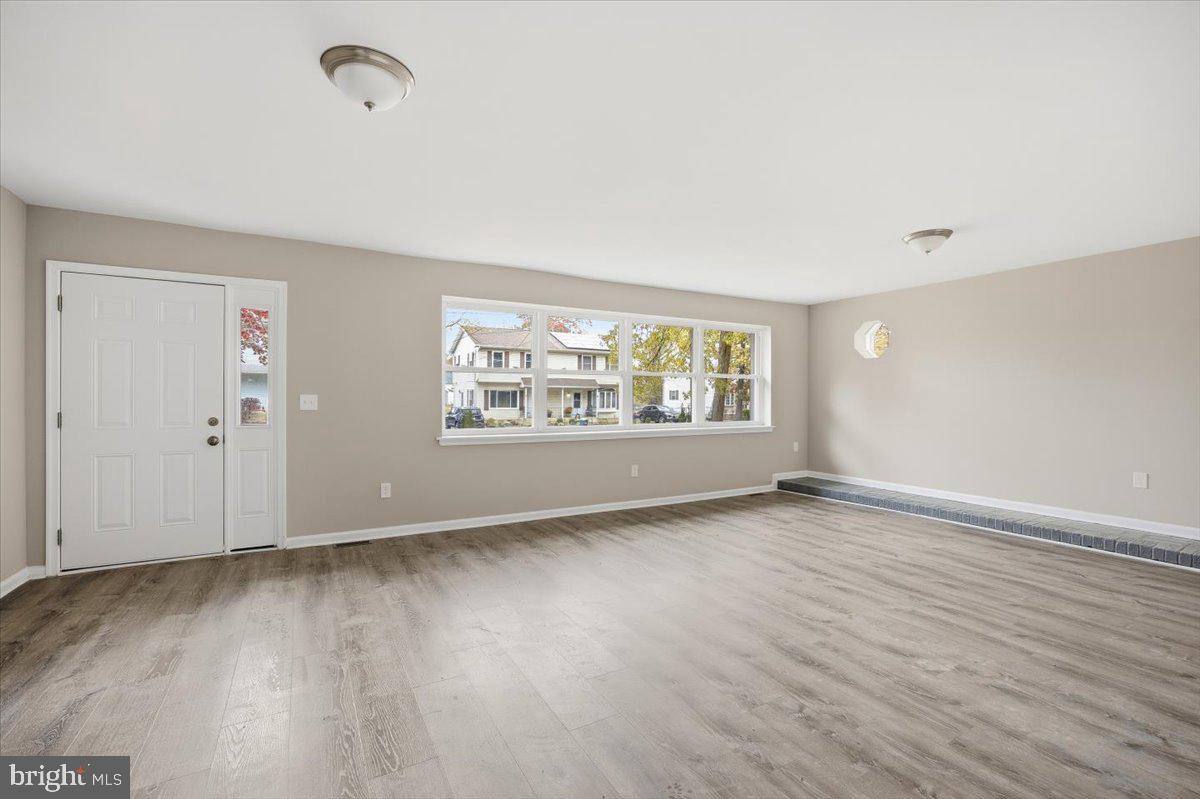 36 Dancy Avenue Sewell, NJ 08080 - Photo 10 of 32 an empty room with wooden floor and windows