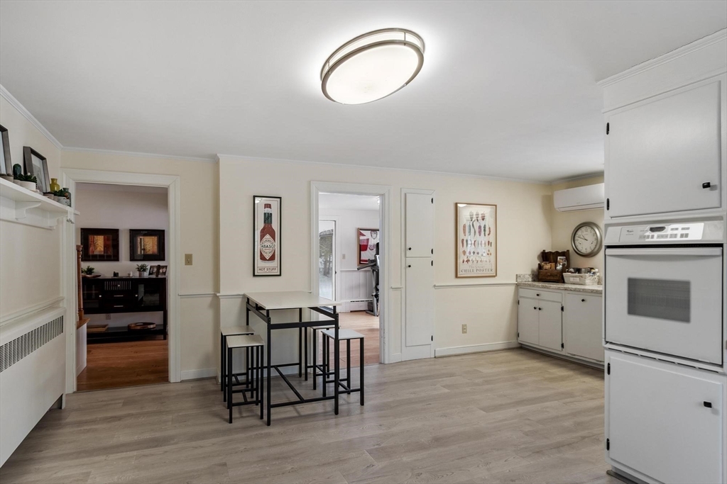 454 Wilson Street Clinton, MA 01510 - Photo 14 of 39 a view of kitchen with furniture and wooden floor