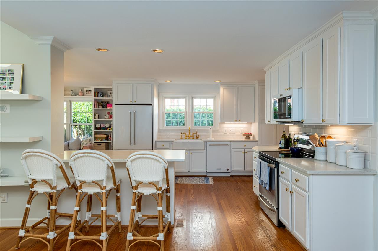 2705 Cooleemee Drive Raleigh, NC 27608 - Photo 10 of 30 The island is the perfect spot to be part of the action or enjoy a casual meal. Kitchen Island