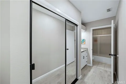 a bathroom with a glass shower door