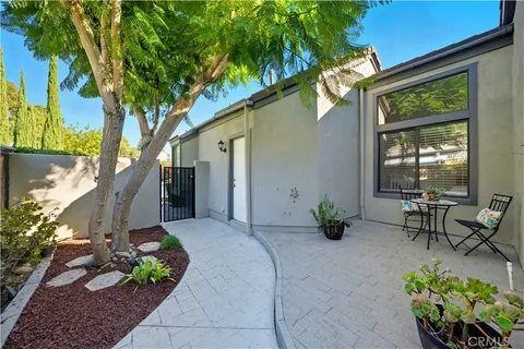 a view of a chairs and table in the patio