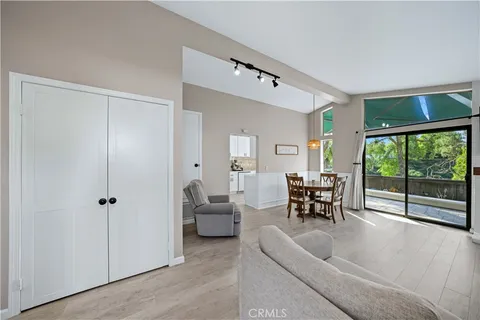 a living room with furniture and large windows