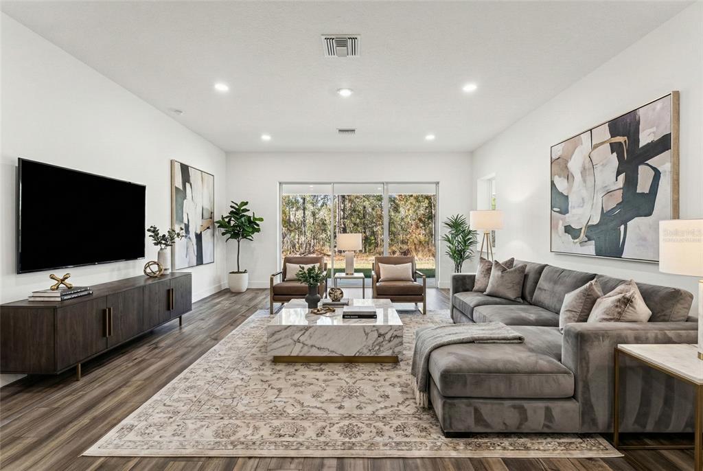 15171 Pomp Parkway Weeki Wachee, FL 34614 - Photo 23 of 50 a living room with furniture and a flat screen tv
