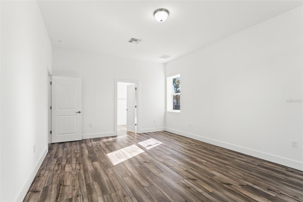 15171 Pomp Parkway Weeki Wachee, FL 34614 - Photo 29 of 50 a view of an empty room and wooden floor