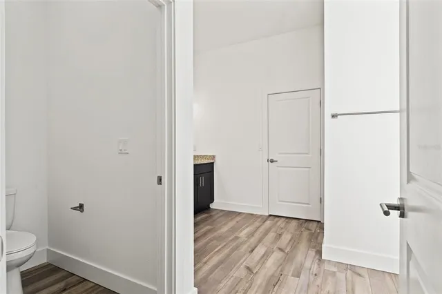 a view of a bathroom with a hardwood floor