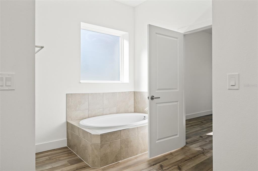 15171 Pomp Parkway Weeki Wachee, FL 34614 - Photo 32 of 50 a bathroom with a sink and a mirror