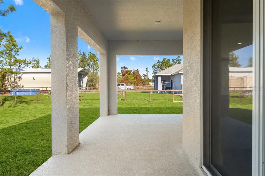 15171 Pomp Parkway Weeki Wachee, FL 34614 - Photo 45 of 50 a view of a house with a back yard