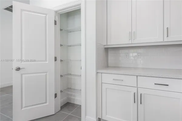 a bathroom with a toilet sink and shower