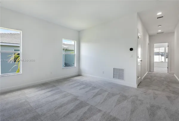 a bathroom with a shower and a mirror