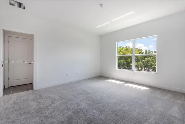 an empty room with closet area