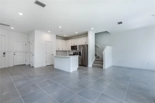 an empty room with windows and view