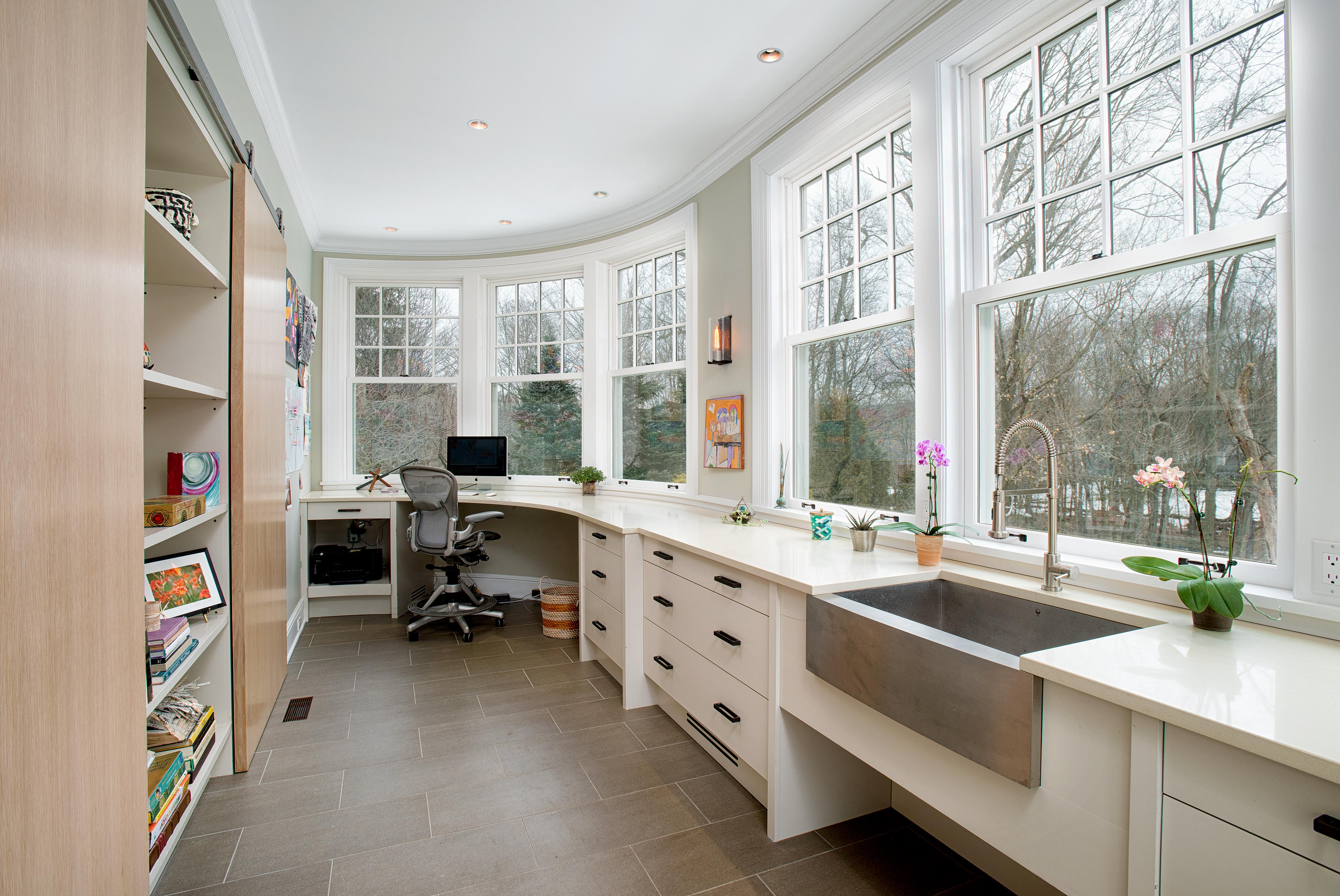 276 White Oak Shade Road New Canaan, CT 06840 - Photo 16 of 36 a room with furniture a large window and a book shelf