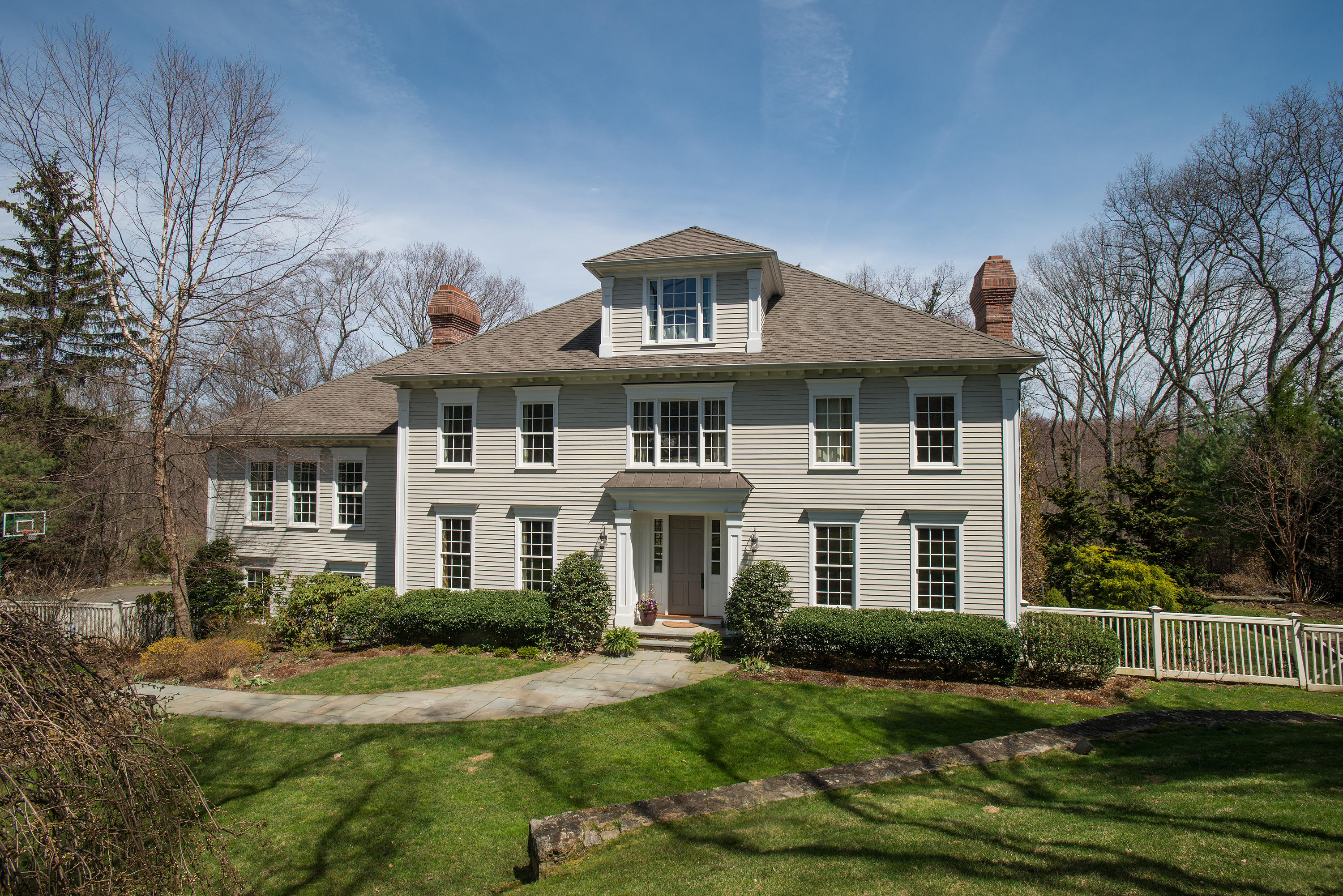 276 White Oak Shade Road New Canaan, CT 06840 - Photo 2 of 36 a front view of a house with a yard